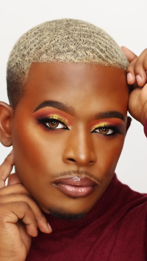 Video of a model with glam orange and gold tones eyeshadow